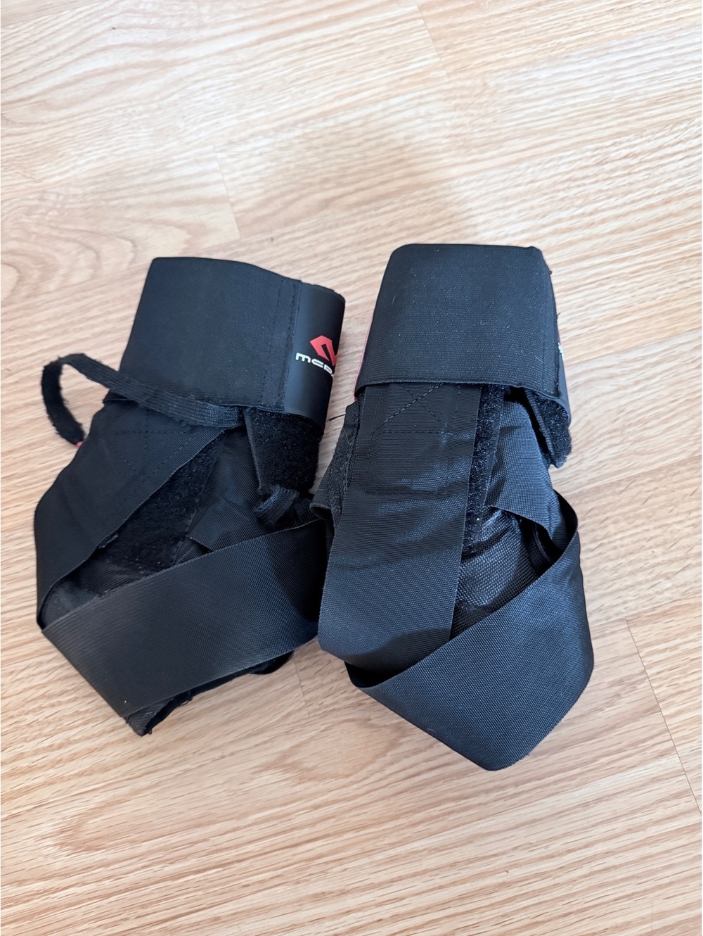 Pair of McDavid Stealth Ankle Braces with Straps – Black